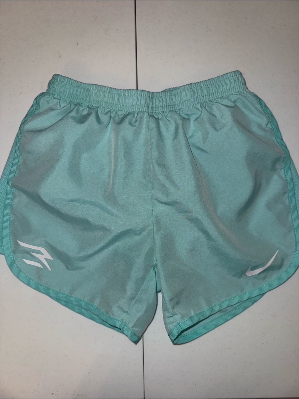 Nike Women’s Mint Green Athletic Running Shorts and striped shorts